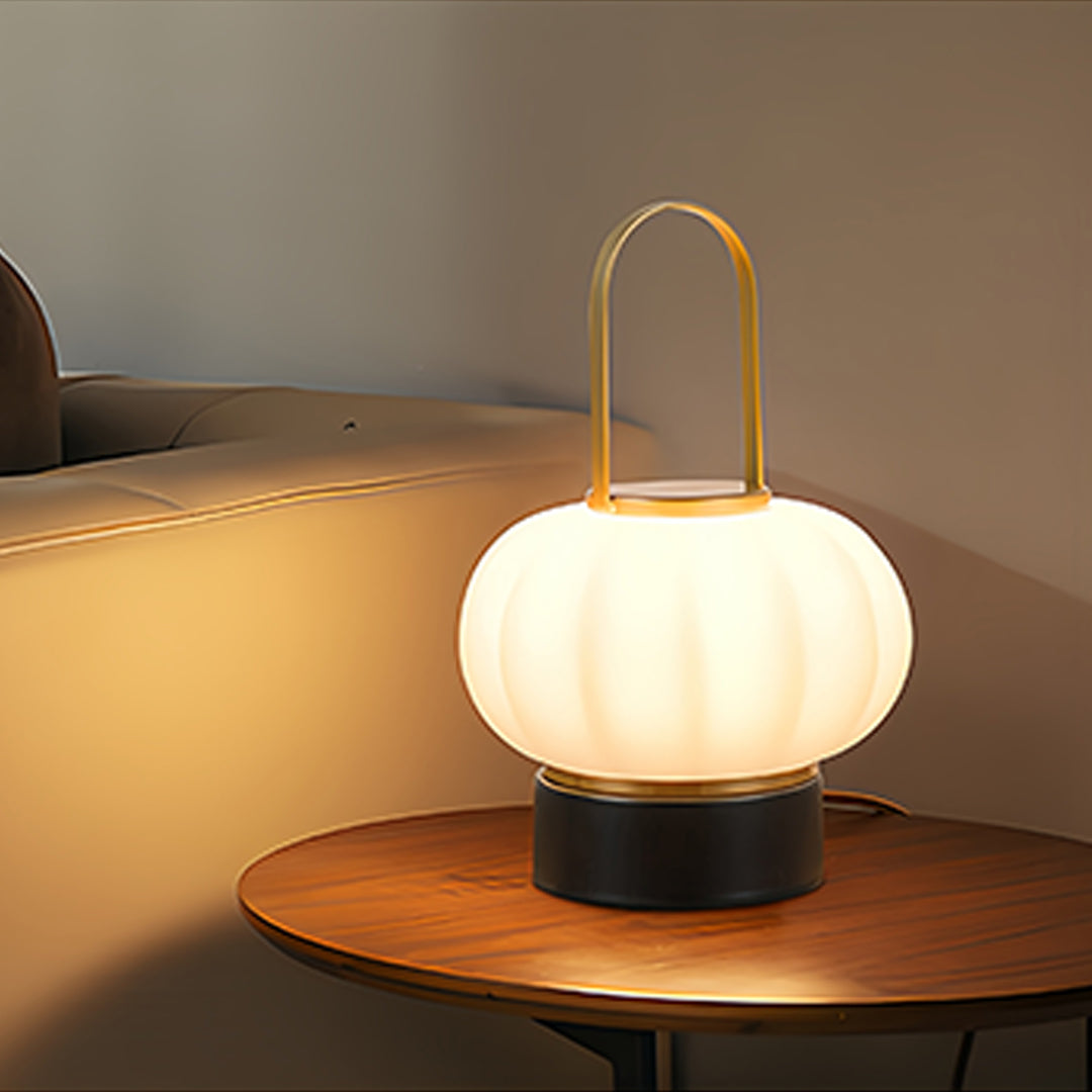 Modern lantern table lamp placed on wooden surface providing soft accent lighting