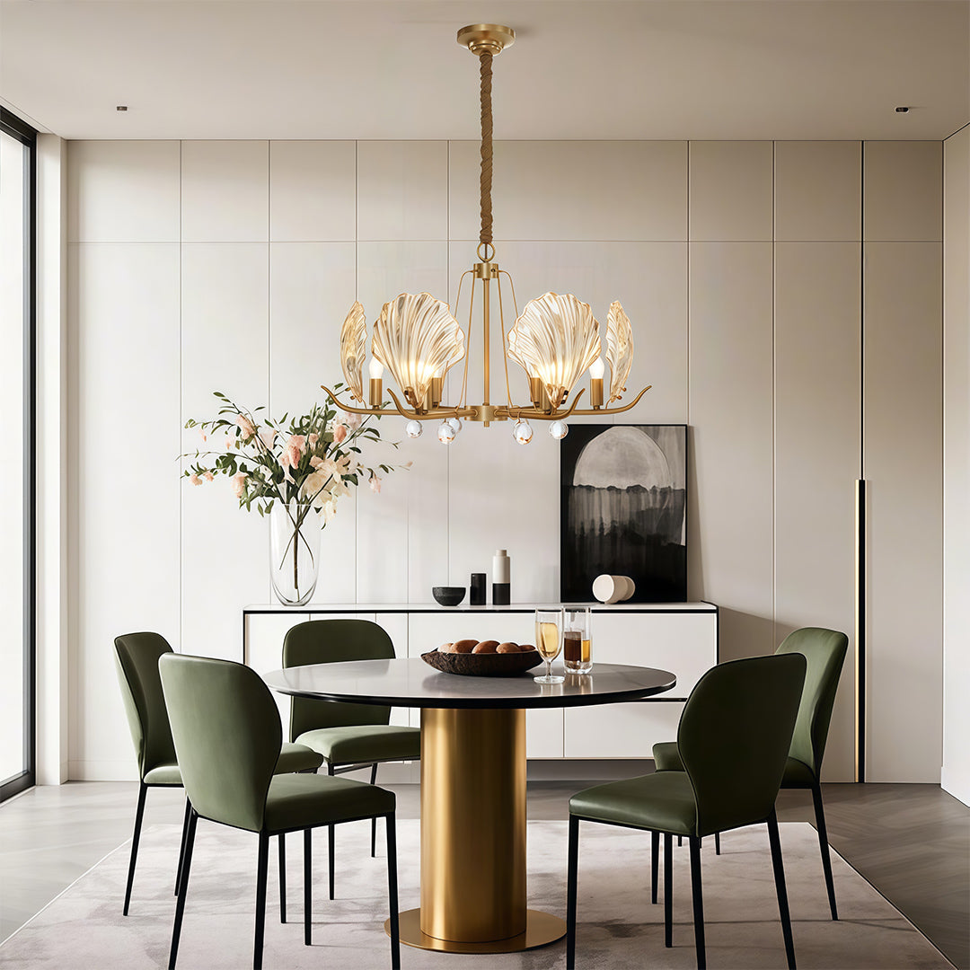 Modern luxury chandeliers creating focal point in contemporary dining space with green chairs