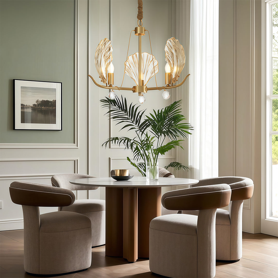 Modern large chandeliers above contemporary living room with brown leather sofas and modern art