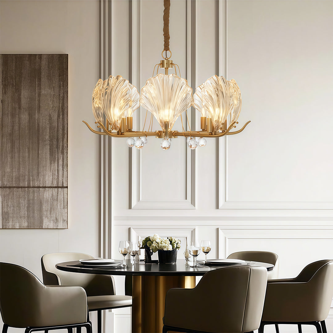 Modern luxury chandeliers lighting transitional dining space with neutral tones and upholstered seating