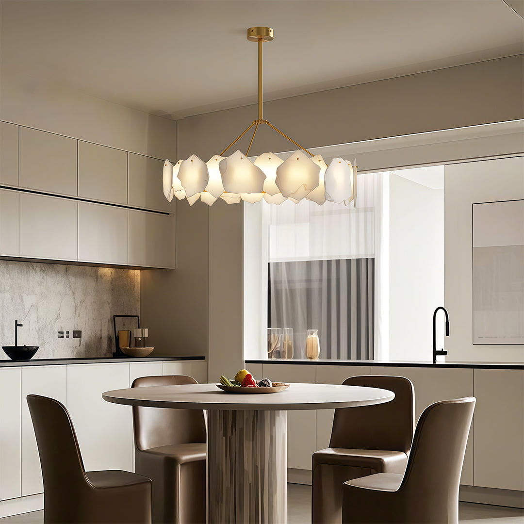 Modern LED chandelier creating ambient lighting in sleek dining space with integrated cabinetry.