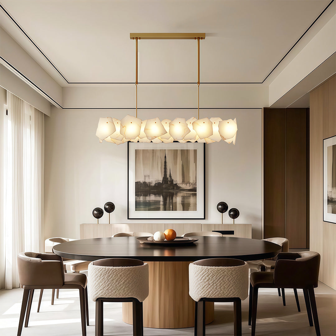 Luxury modern LED chandelier lighting bright open dining space with floor-to-ceiling windows.