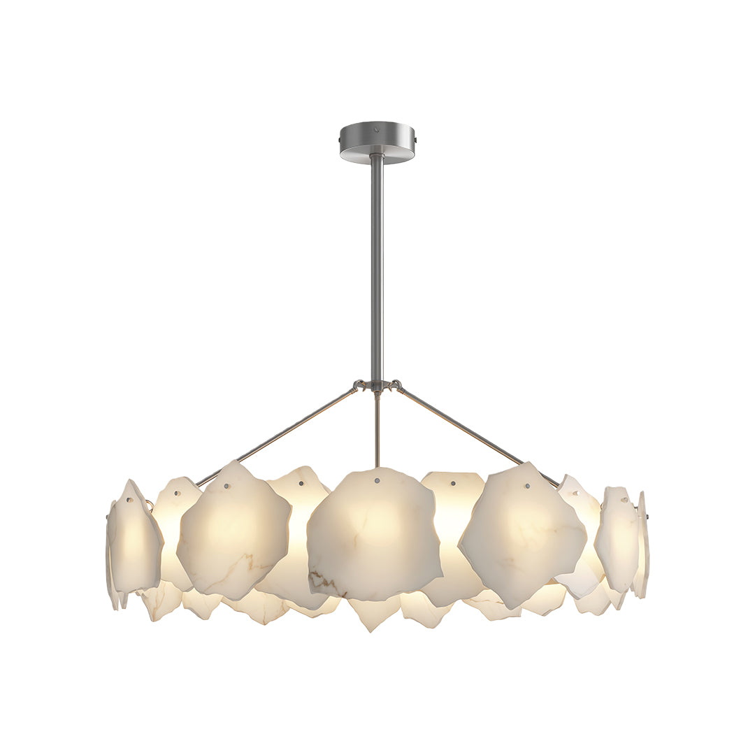 Luxury modern LED chandelier above modern dining table with fluted wood base and white chairs.