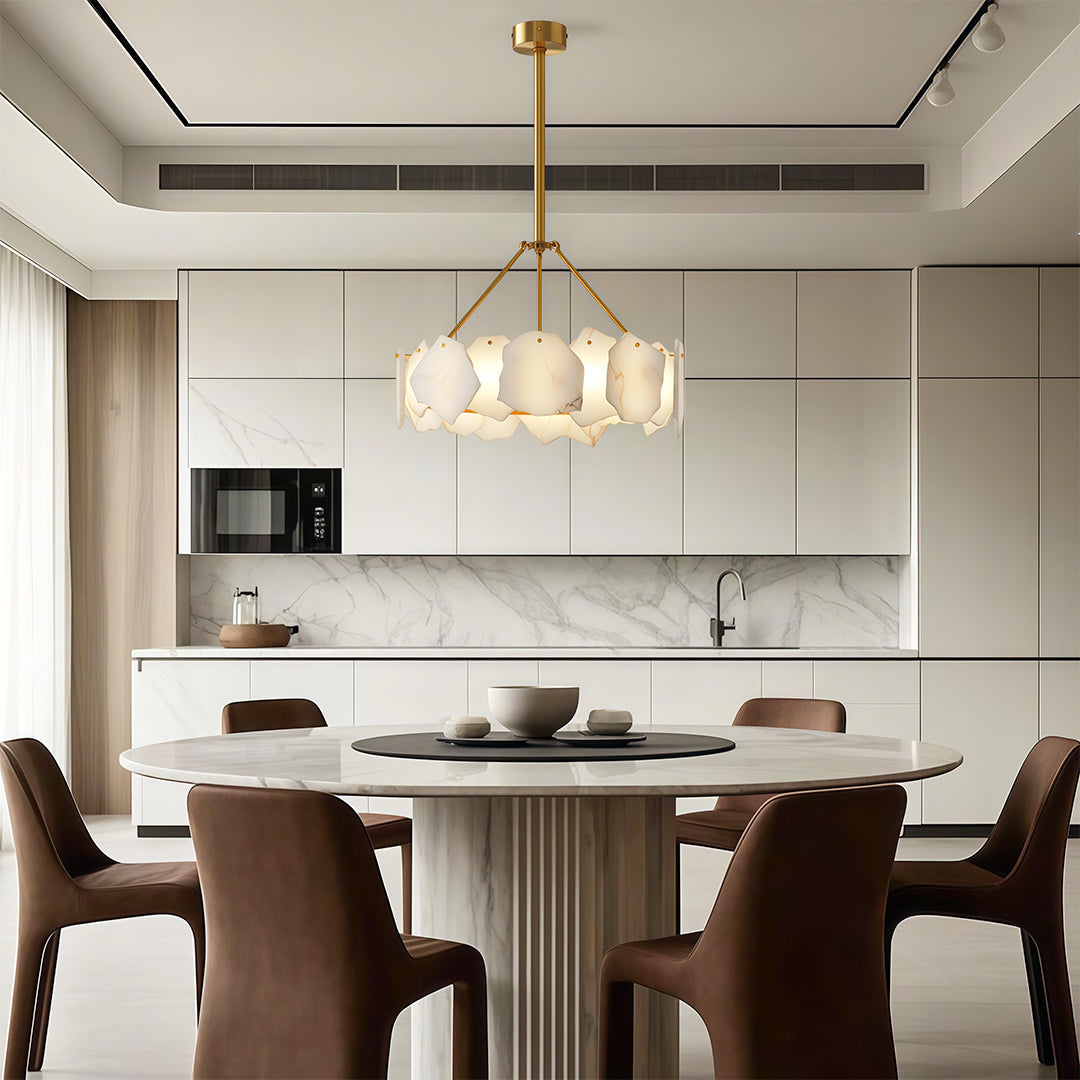 Luxury modern LED chandelier creating warm glow in elegant dining room with wood and brass accents.