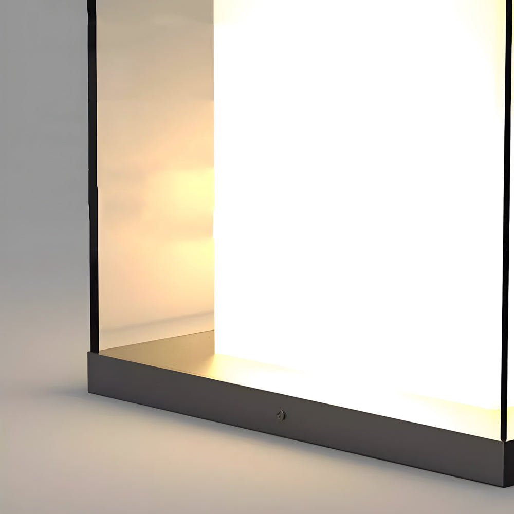 Modern LED gate pillar light with sleek black frame creating warm ambient lighting