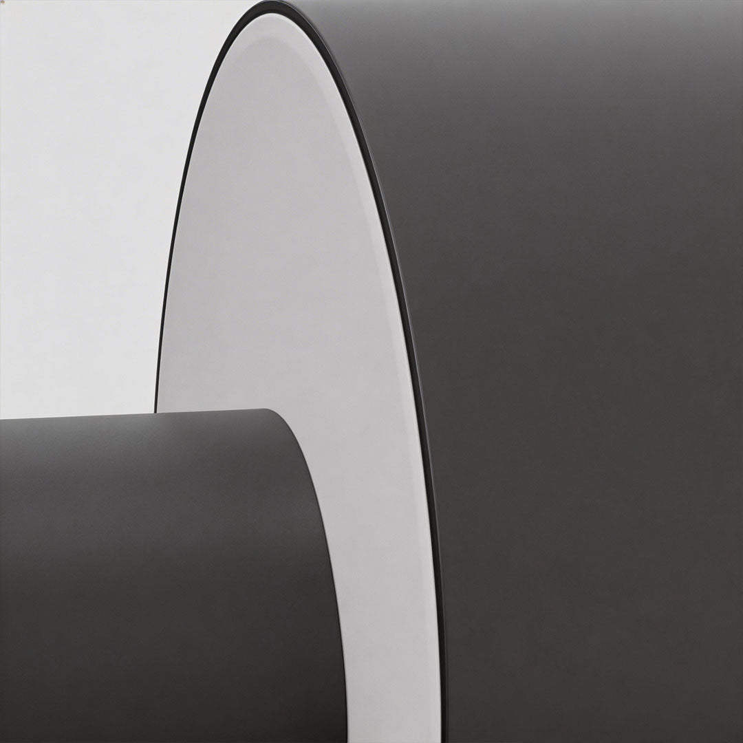 Modern LED outdoor wall light with a black and gold finish, casting a soft glow.