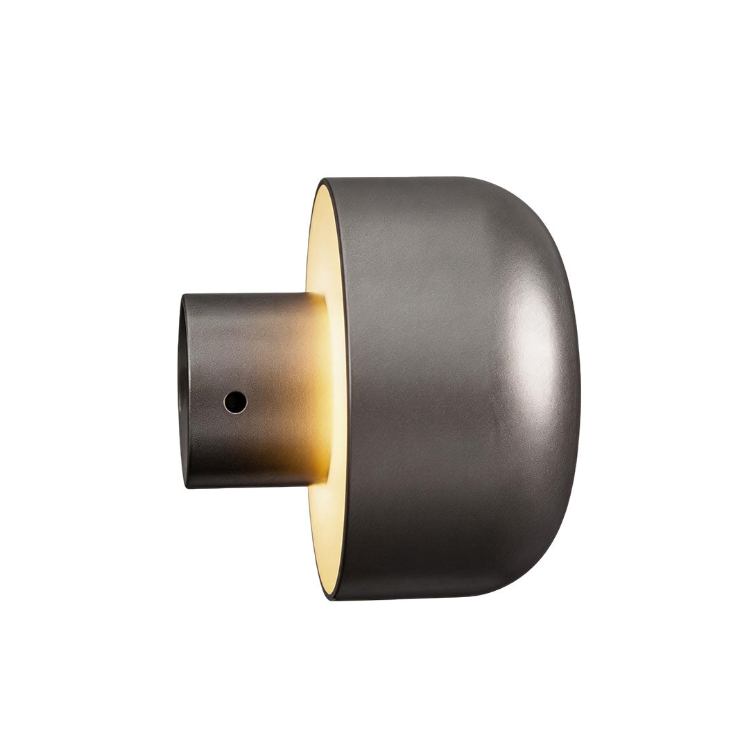 Modern LED outdoor wall light with a black top and illuminated base for outdoor spaces.