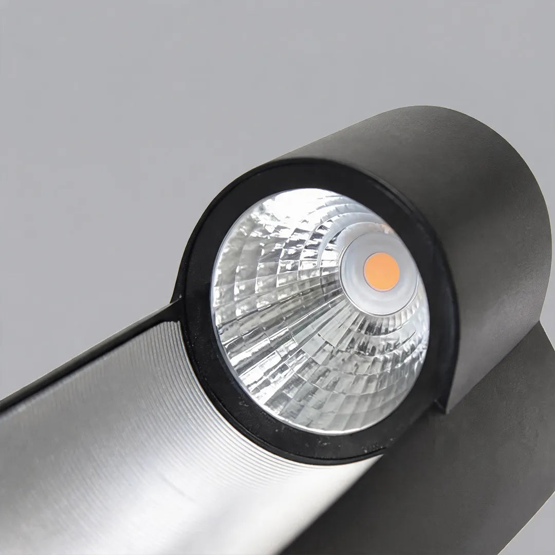 Modern LED outdoor wall light close-up highlighting the integrated LED source and reflective inner surface.