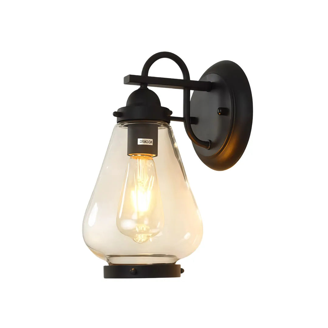 Modern LED outdoor wall light casting warm downward illumination on a contemporary patio wall.