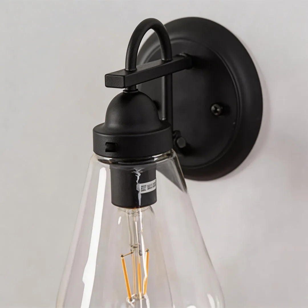 Modern LED outdoor wall light close-up showing the integrated LED source and focused reflector design.