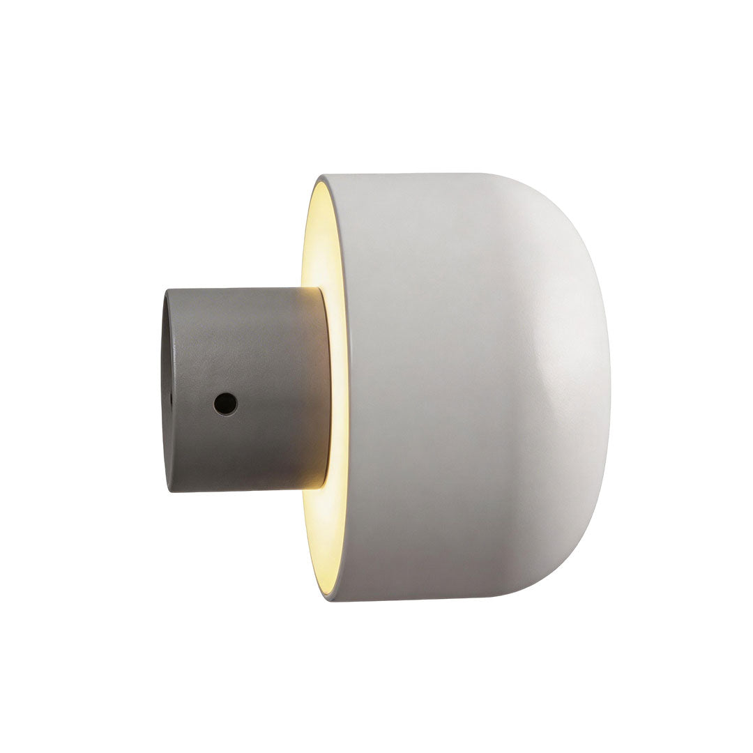 Modern LED outdoor wall light with a white finish and warm light for residential entrances.