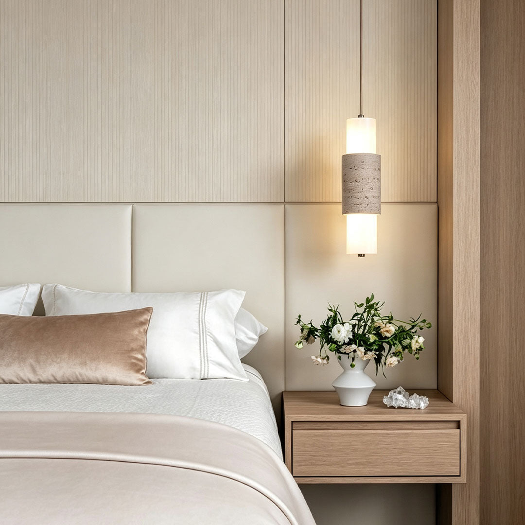 Modern LED pendant lights installed beside a bed with warm ambient illumination and natural finishes.