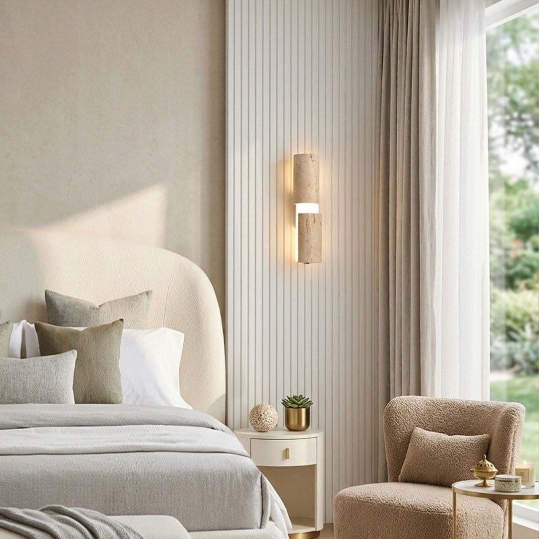Modern LED wall lights installed beside a bedroom window with soft warm ambient illumination.