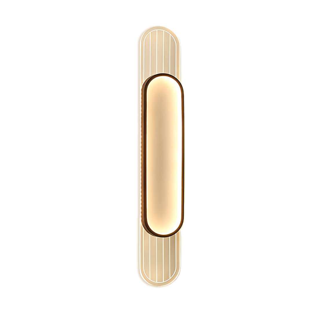 Modern linear led wall light with elongated oval shape in brass finish and textured vertical detailing