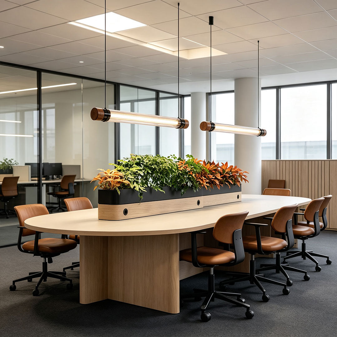 Modern linear pendant lighting suspended above a contemporary reception area, providing sleek architectural illumination.