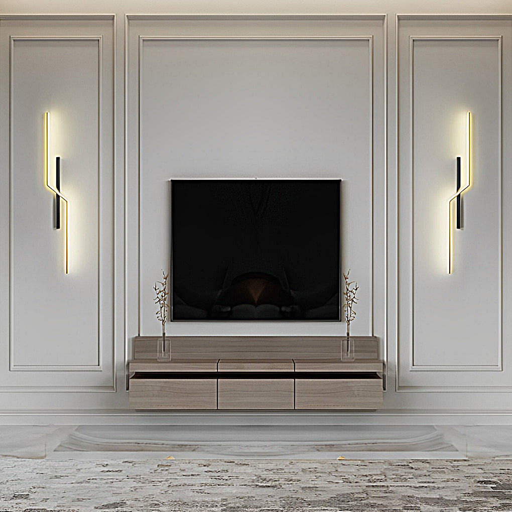 Symmetrical modern linear wall sconce installation framing fireplace wall in elegant living room.