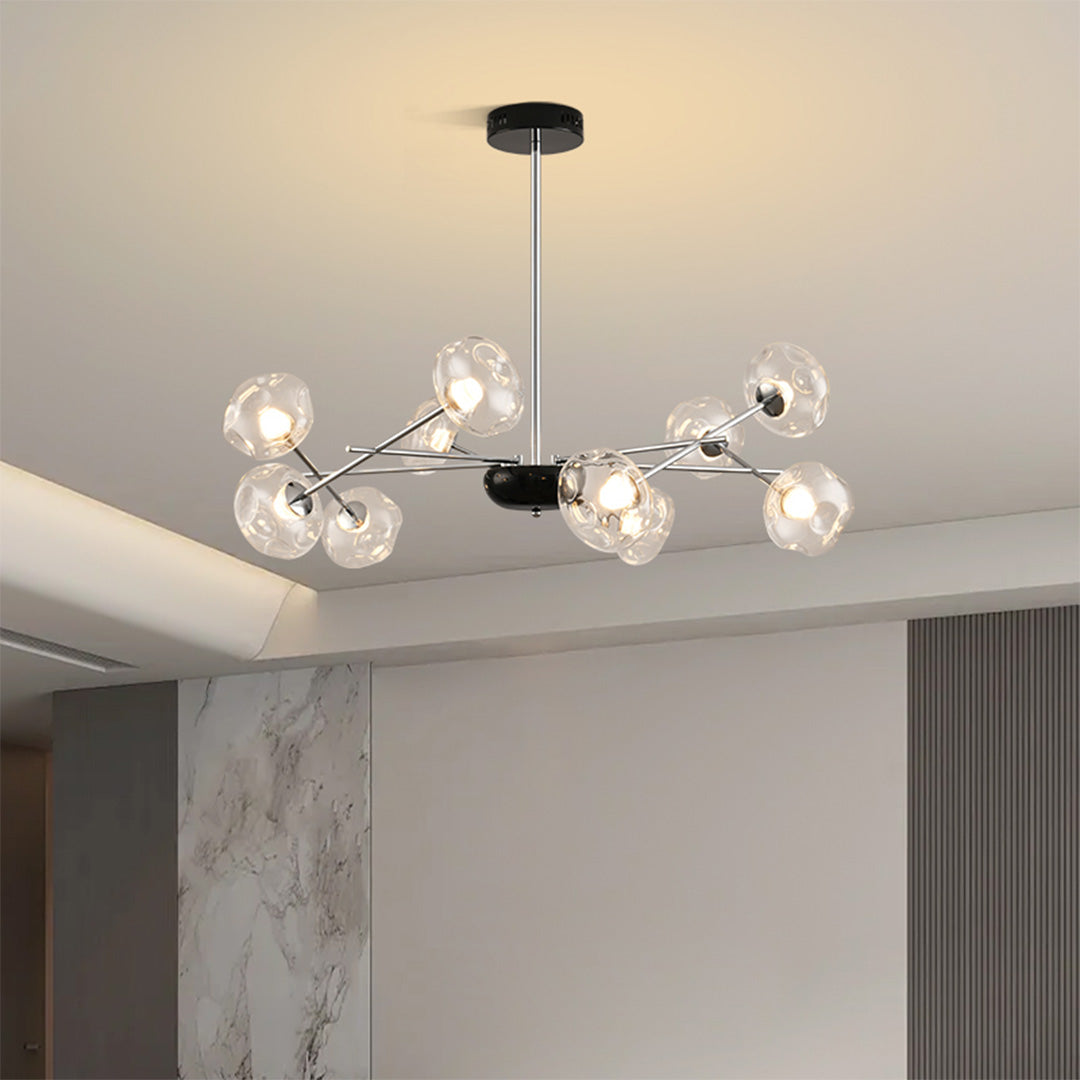 Stylish LED chandelier lights illuminating modern living room with warm ambient glow and glass orbs