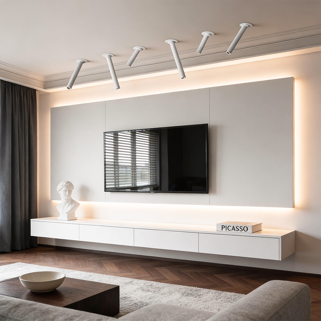 Modern living room featuring sleek LED surface spotlights with adjustable heads, mounted on the ceiling for focused lighting.