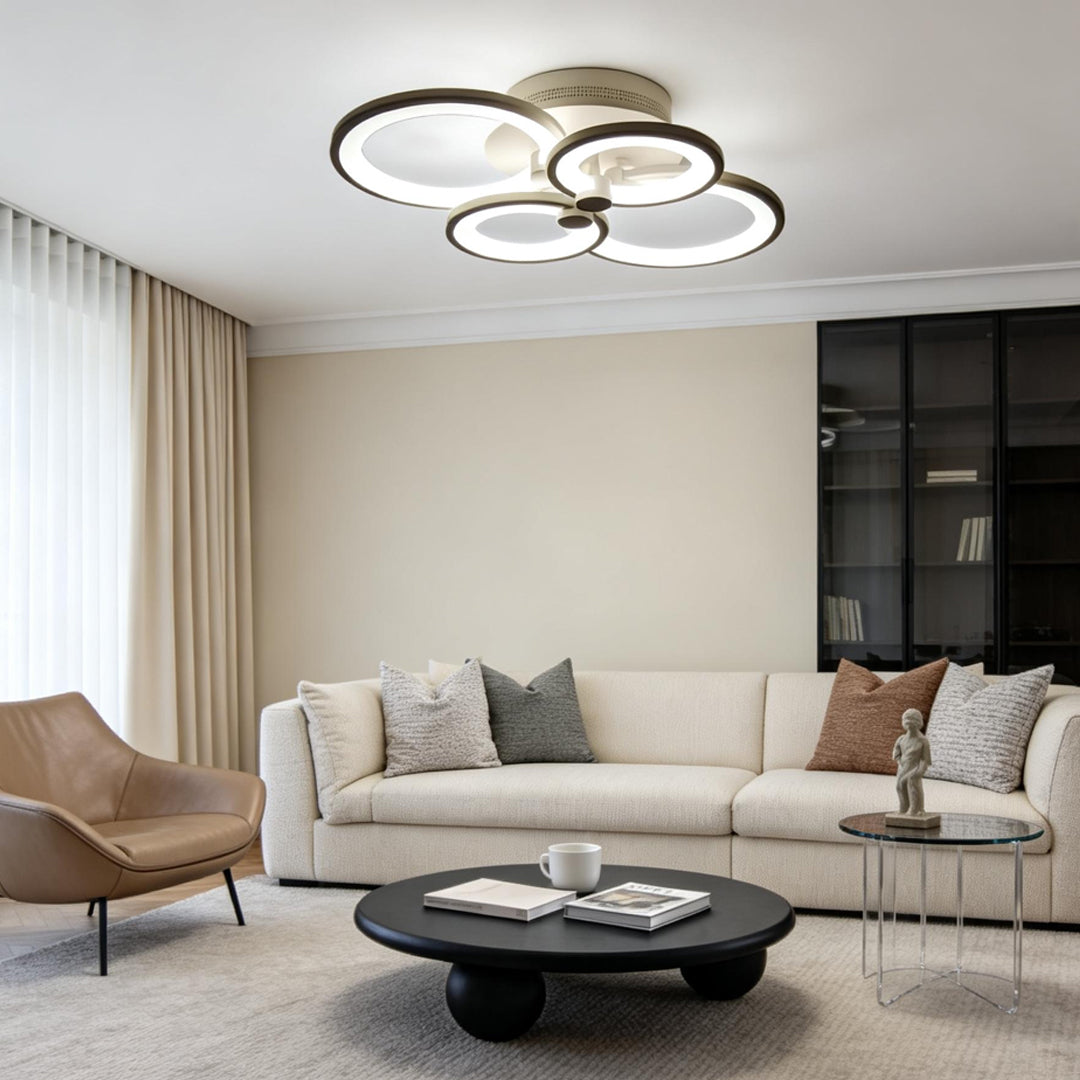 Modern living room styled with elegant gold multi ring ceiling lights creating soft ambient illumination.