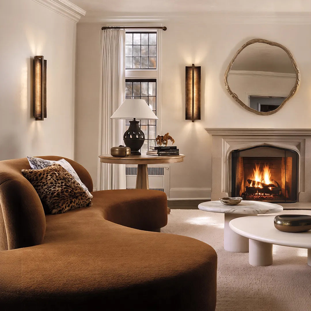 Modern living room with vertical wall sconces fireplace and elegant neutral decor