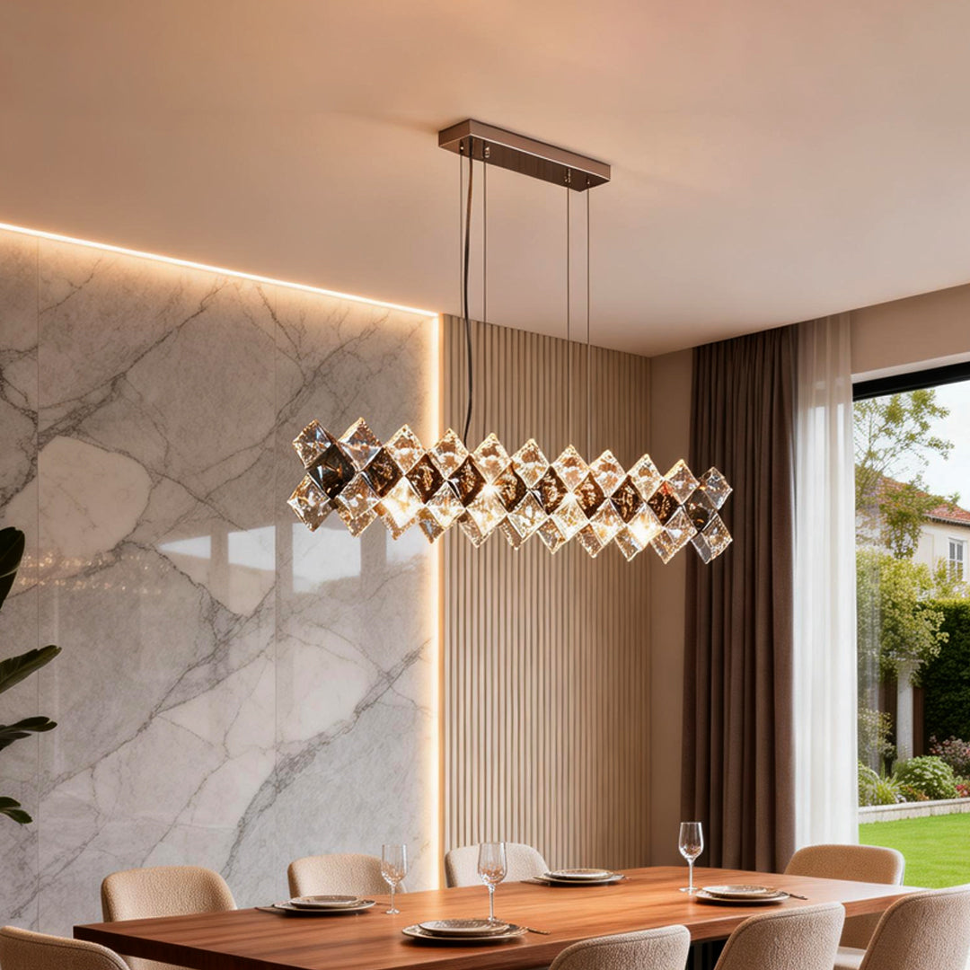 Modern luxury crystal room dining chandeliers illuminating an elegant dining area with warm, golden glow.