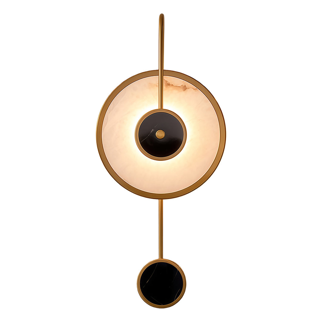 Modern marble wall light featuring brass circular frame with central black orb and vertical rod