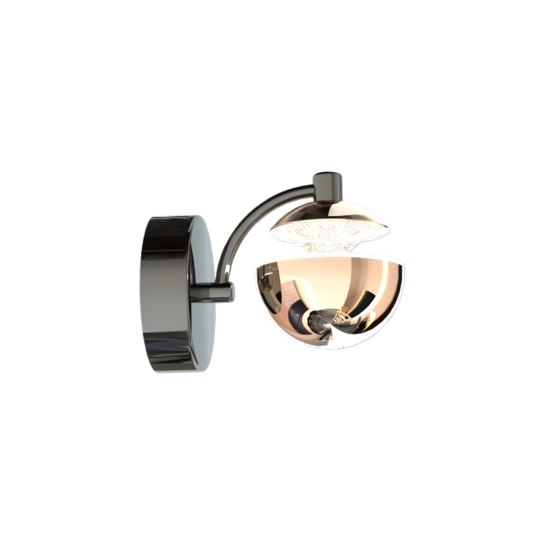 Modern metal wall sconce with single globe shade and rotating arm in contemporary black and brass mixed finish