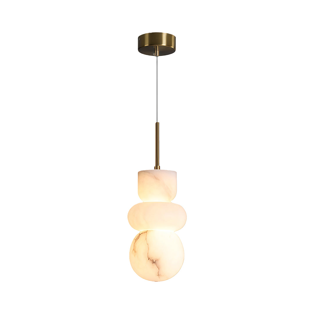 Modern minimalist pendant light featuring glass shade chandelier aesthetic in tiered organic stone discs with brushed brass hardware.