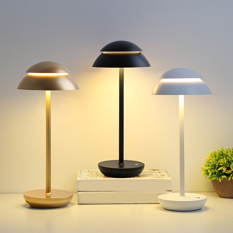 Modern mushroom table lamp enhancing a minimalist desk setup with elegant light.