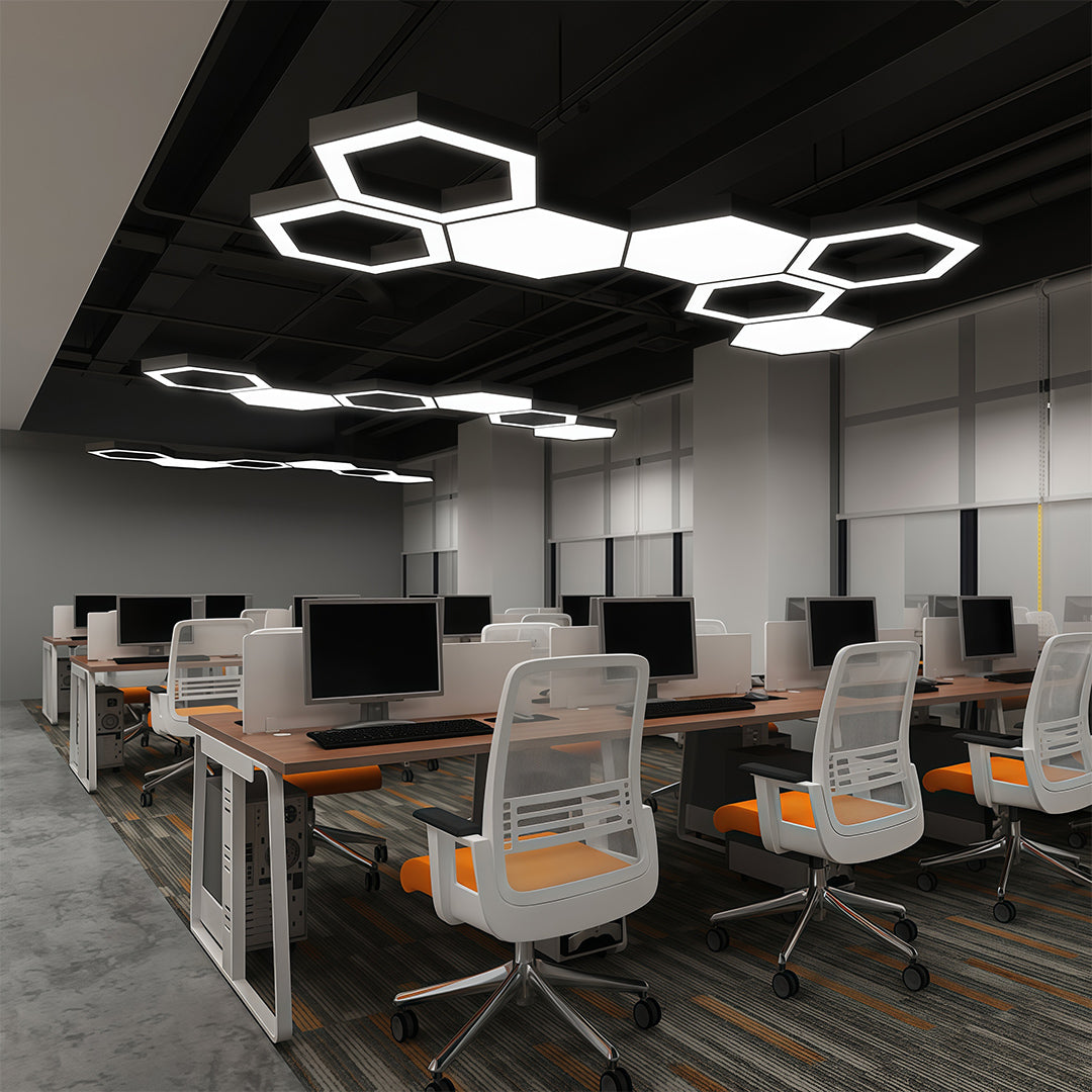 Modern geometric chandelier in a modern office space, featuring clean lines and bright LED light.