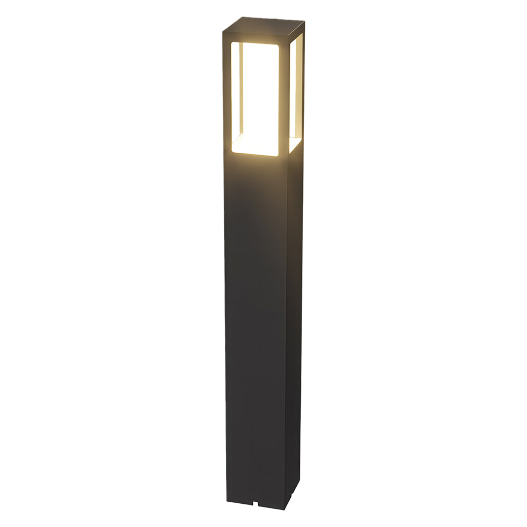 Modern outdoor bollard light with a tall black rectangular design, ideal for landscape lighting.