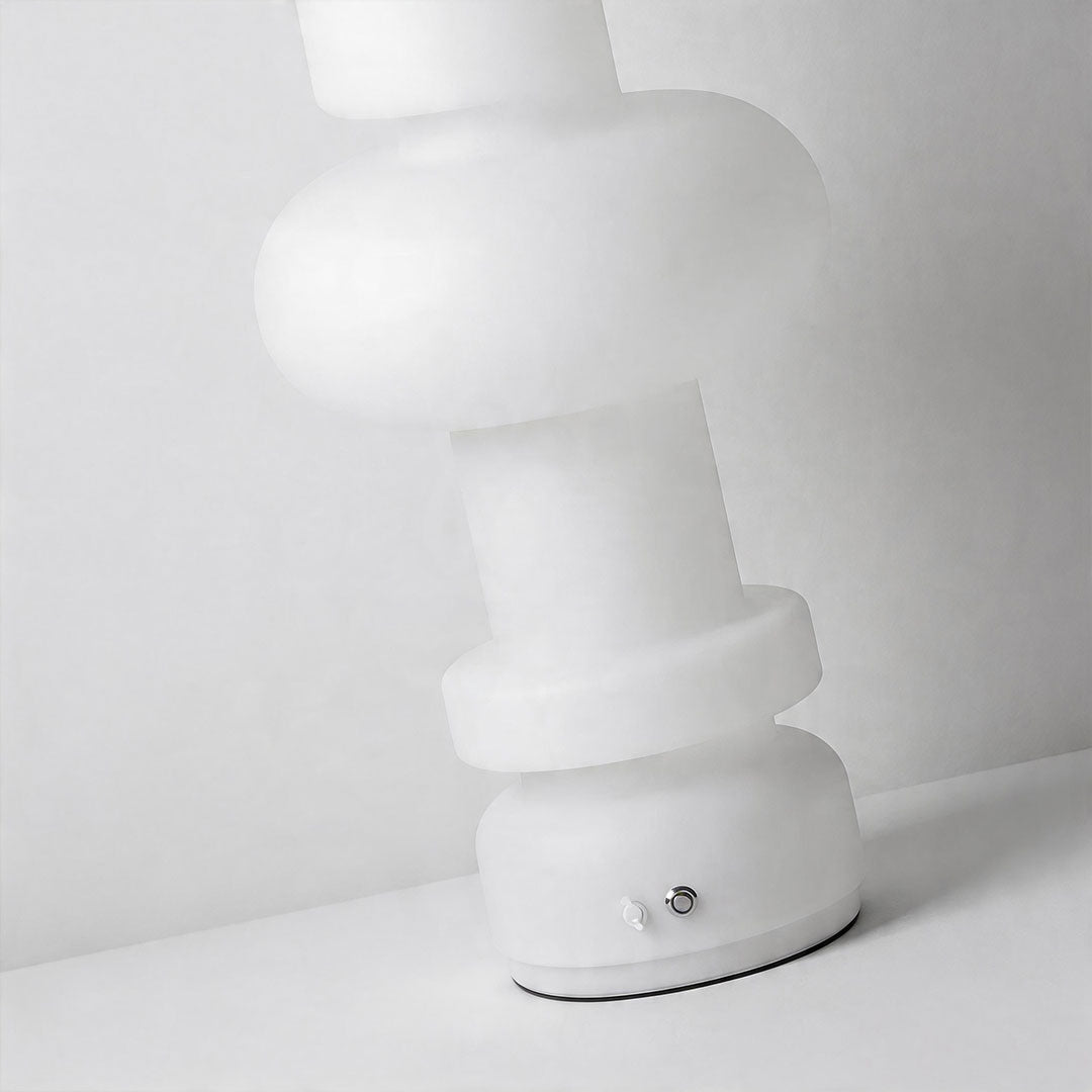Modern outdoor floor lamps close-up featuring smooth rounded shapes and soft ambient illumination.
