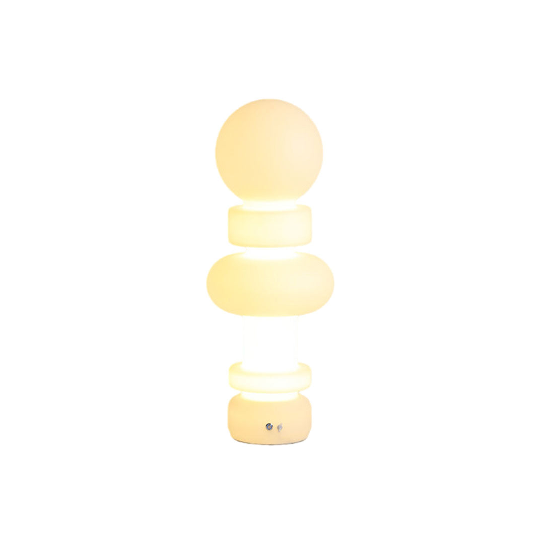 Modern outdoor floor lamps tall version with sculptural glowing silhouette and contemporary styling.