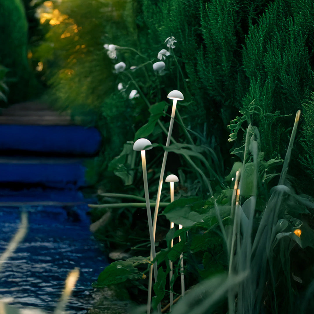 Modern outdoor lights for landscaping featuring sleek design with lush green foliage backdrop