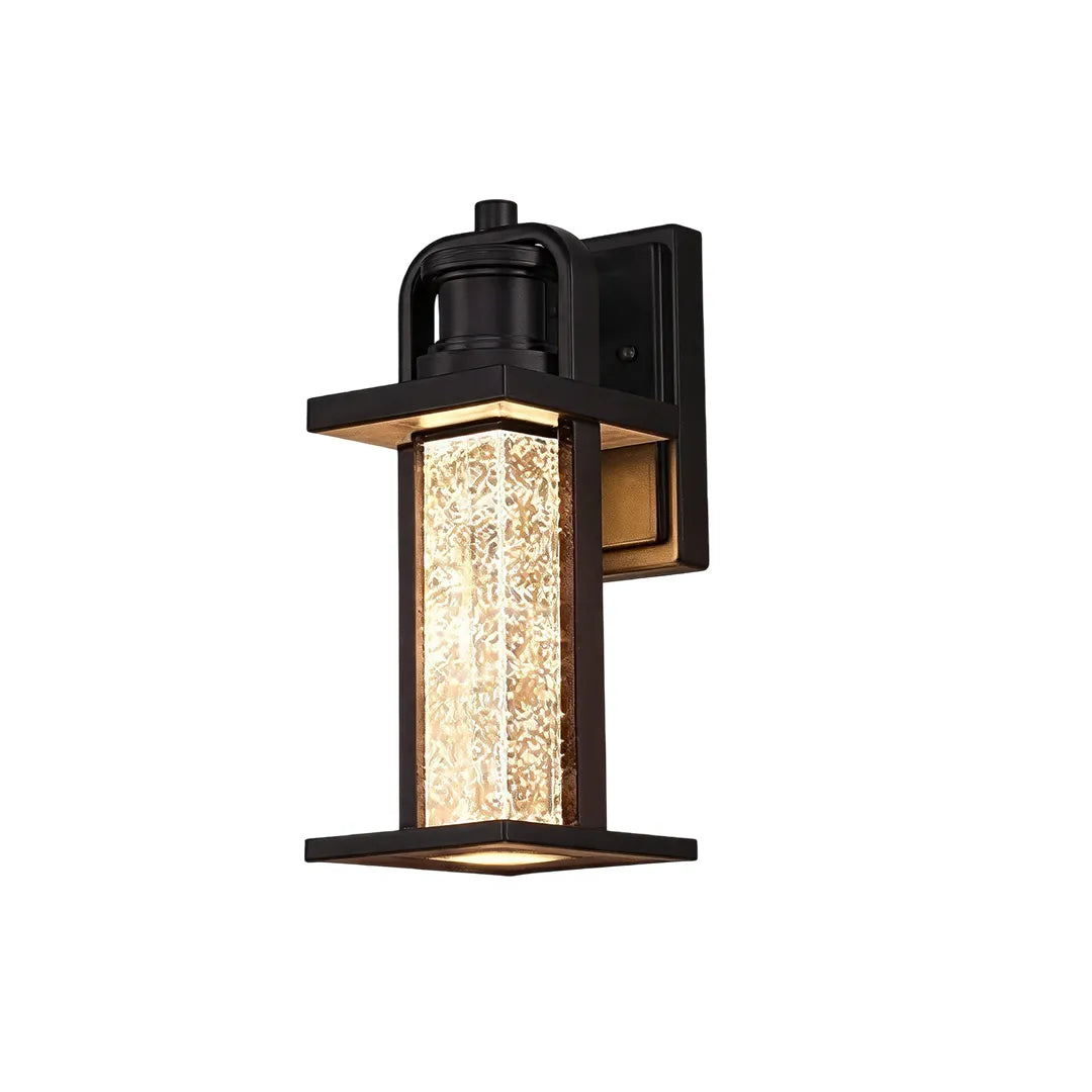 Modern outdoor lantern wall sconce product image with a compact top cap and glowing seeded glass design.