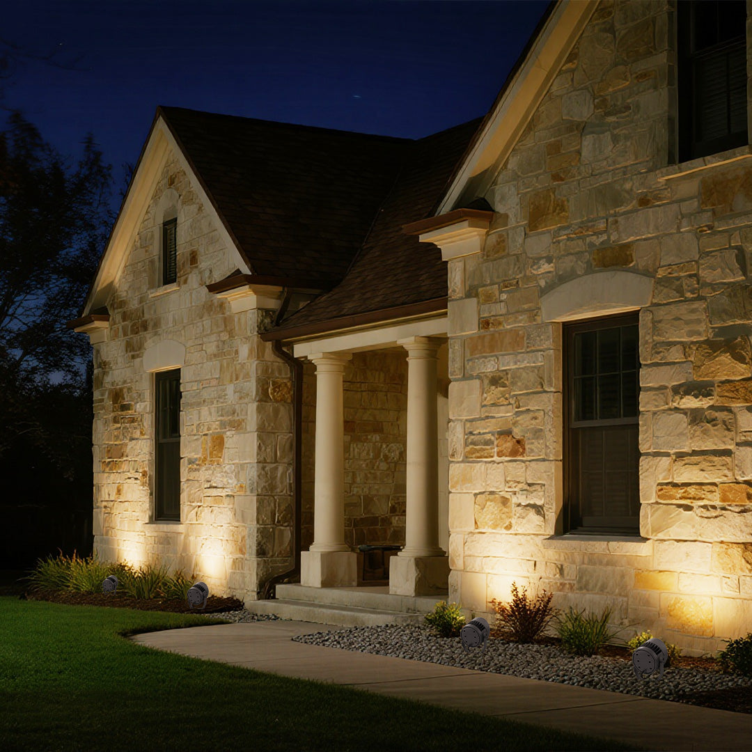 Modern outdoor LED garden spotlights providing accent lighting for residential building facade