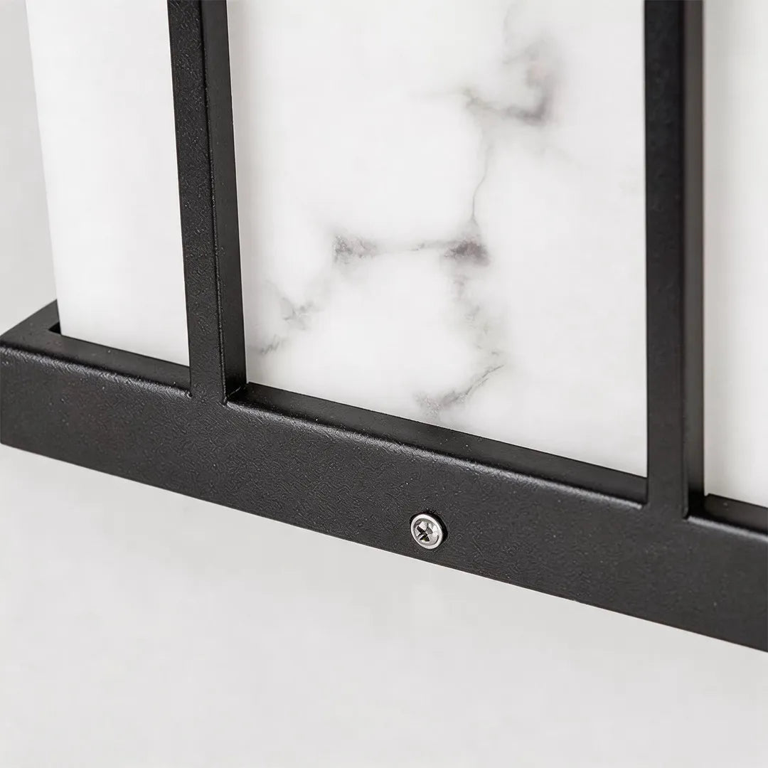 Modern outdoor pillar light with marble effect glass and black metal frame detail
