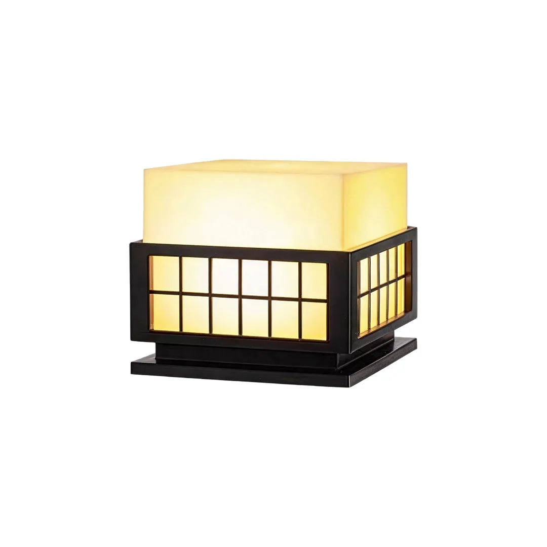 Modern outdoor pillar lights featuring a black metal frame and frosted diffuser on a white background.