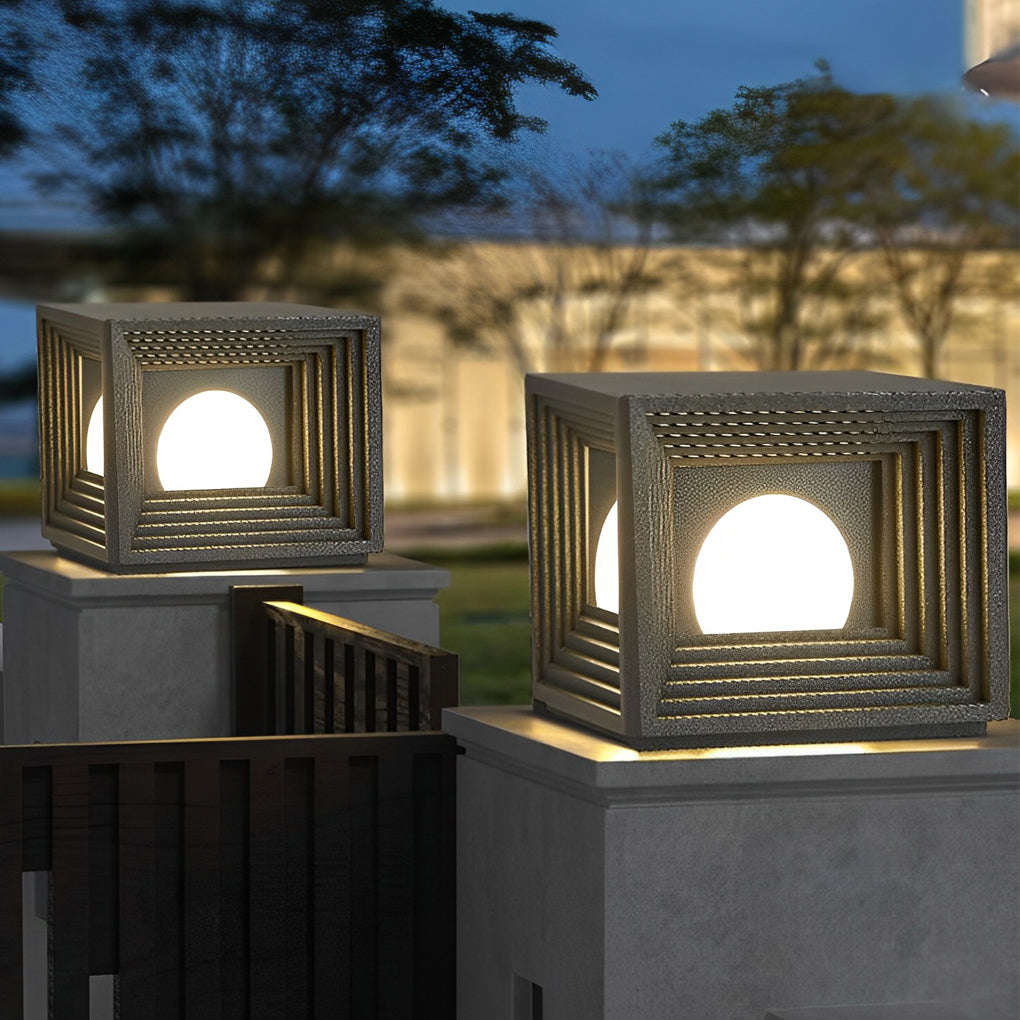 Modern outdoor pillar lights with a close-up of their glowing geometric pattern.