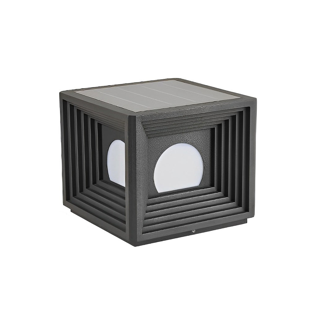 Modern outdoor pillar lights with a close-up of their illuminated cube structure at night.