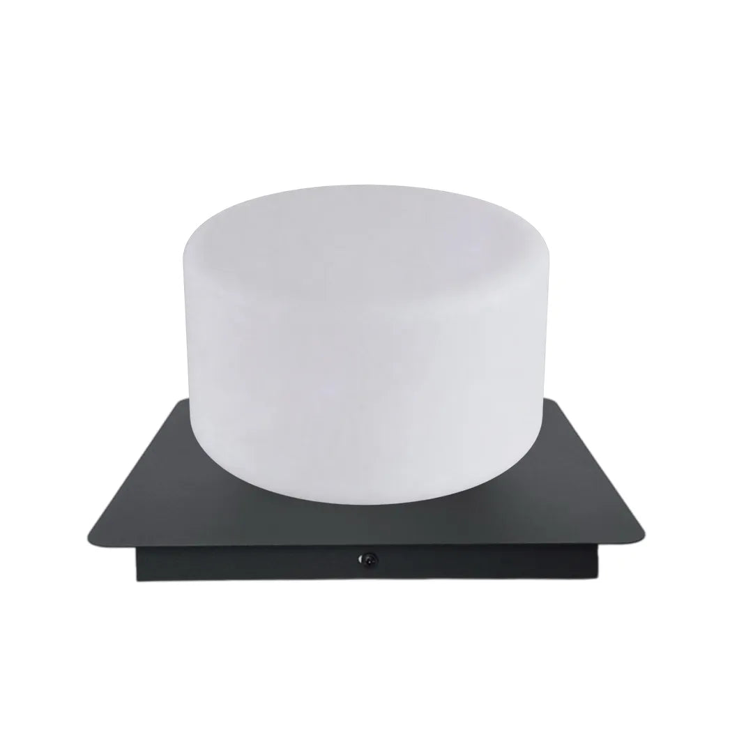 Modern outdoor pillar lights with a white cylindrical shade on a black square base shown on white.