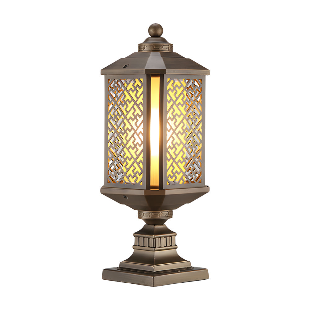 Modern outdoor pillar lights with a decorative bronze finish, mounted on a stone base.