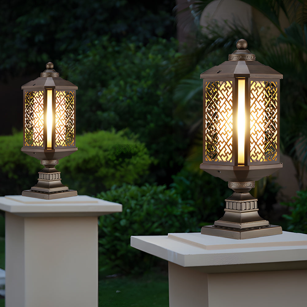 Modern outdoor pillar lights with a decorative design, mounted on a stone pillar.