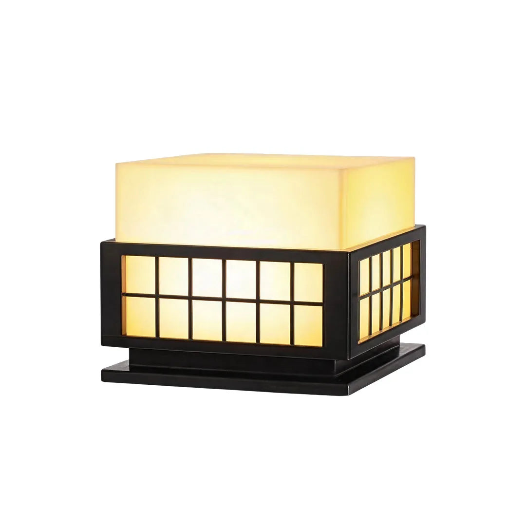 Modern outdoor pillar lights with a contemporary geometric design and warm illuminated diffuser.