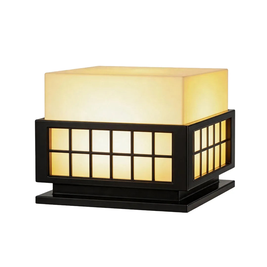Modern outdoor pillar lights showcasing a minimalist black frame with a soft glowing diffuser.
