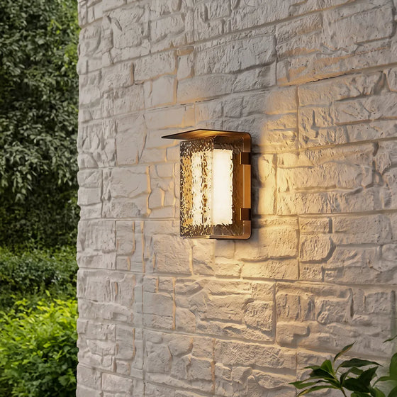 Modern outdoor solar wall lights mounted on a light stone exterior wall with a warm textured glow.
