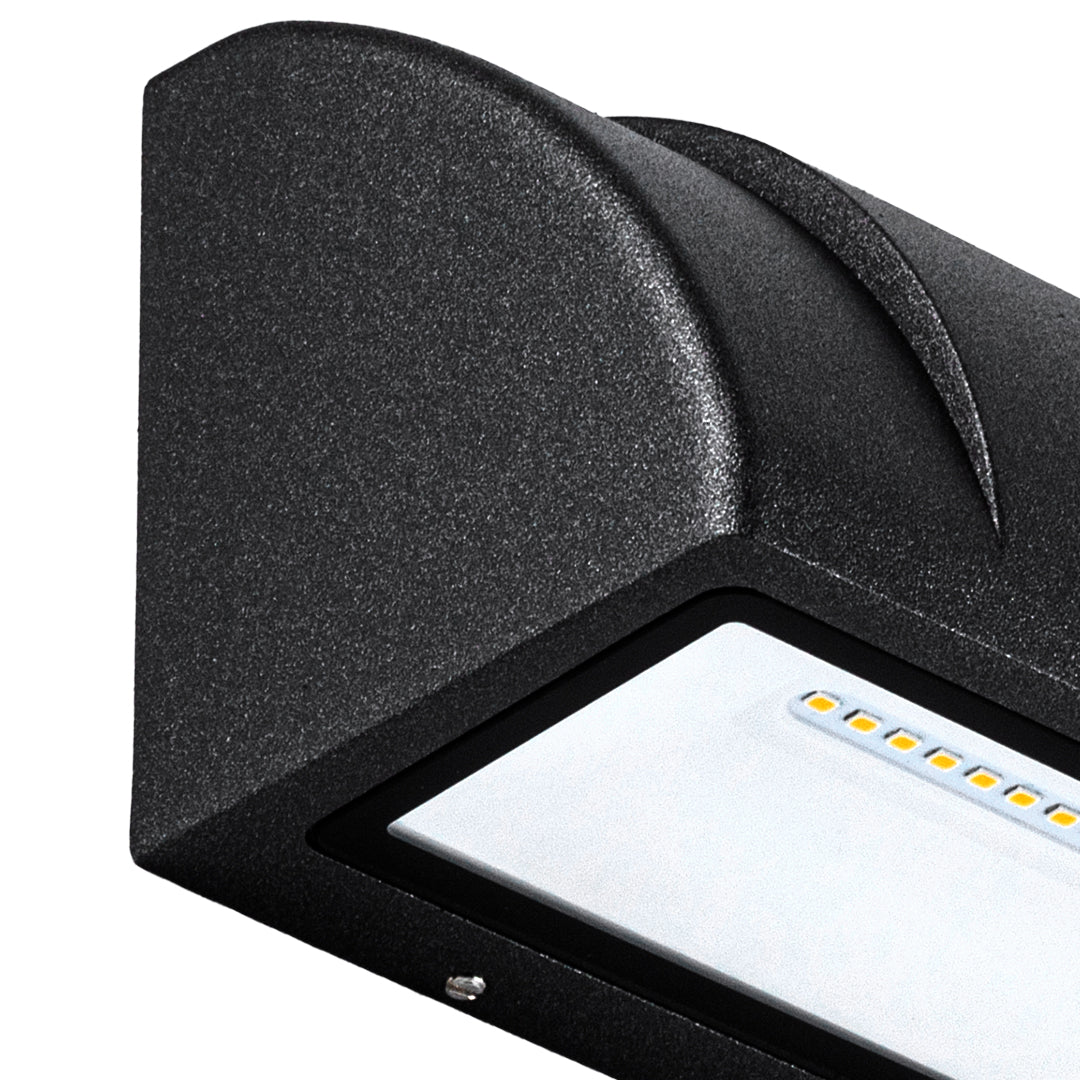 Detailed side view of a modern outdoor wall light highlighting its smooth black surface and compact LED design.