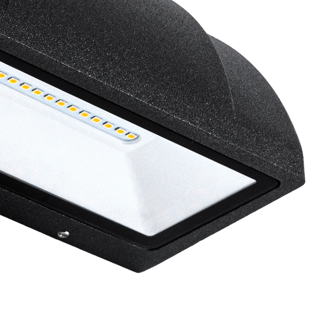 Angled view of a modern outdoor wall light showing its curved housing and wide downward light distribution.