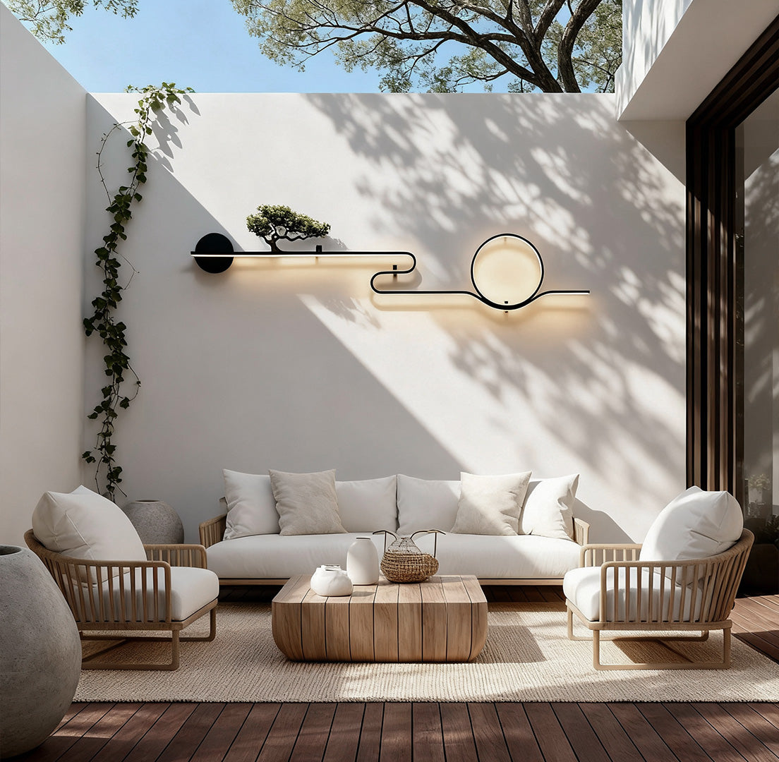 Modern outdoor wall lights with circular LED design mounted on a concrete garden outdoor wall daytime
