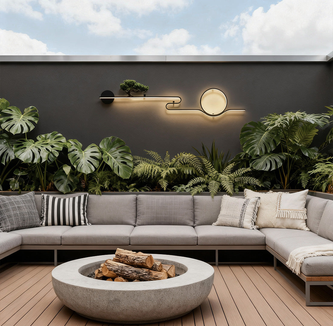 Modern outdoor wall lights with circular LED design mounted on a concrete garden wall daytime